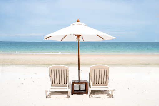 Two deckchairs on a beautiful beach . Thailand