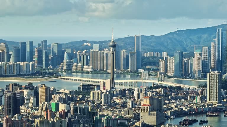 Aerial photography of Macau city skyline on sunny day. Creative video with ads and trademarks removed