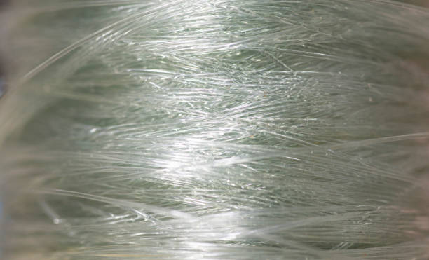 istock Blurred image of transparent white synthetic fiber surface 1694868195