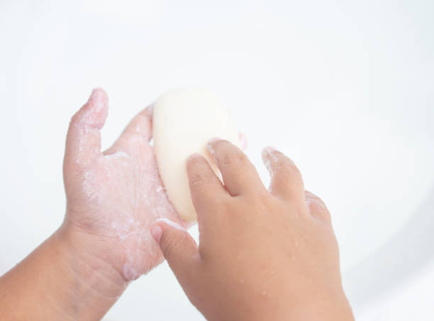 istock child hand gesture cleaning washing hands with soap 1694875764