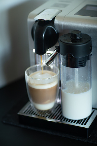 coffee capsule machine and milk dispensing Caffe latte.