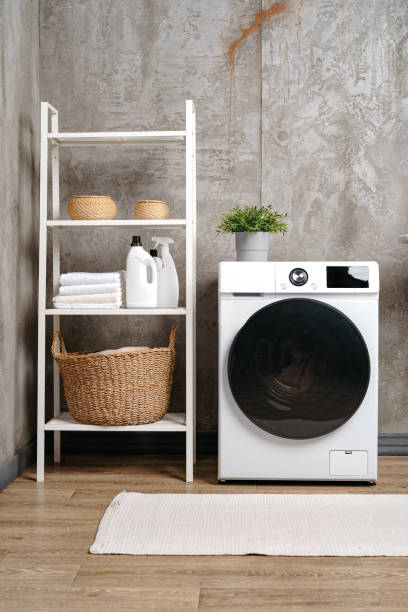 istock Washing machine in a gray modern laundry room 1694911582