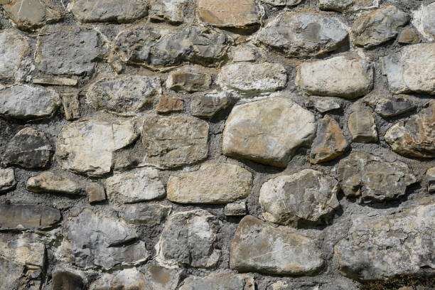 Stone wall cutout suitable as background with a lot of copy space. The wall is captured close up.