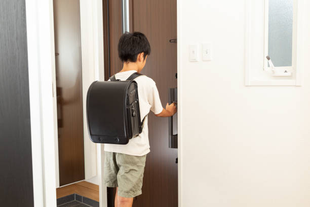 istock A boy opens the front door and leaves. 1694944344