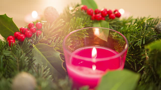 Decorated Advent wreath with glowing candles