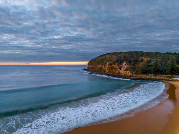 istock Stratus cloud filled sunrise over the ocean 1694953930