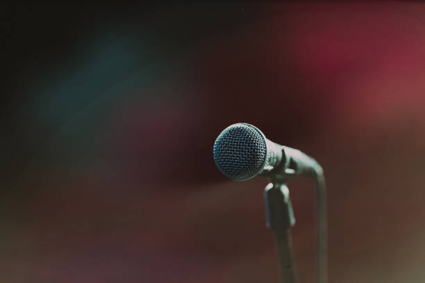 istock Microphone against blur of light colors 1694956676