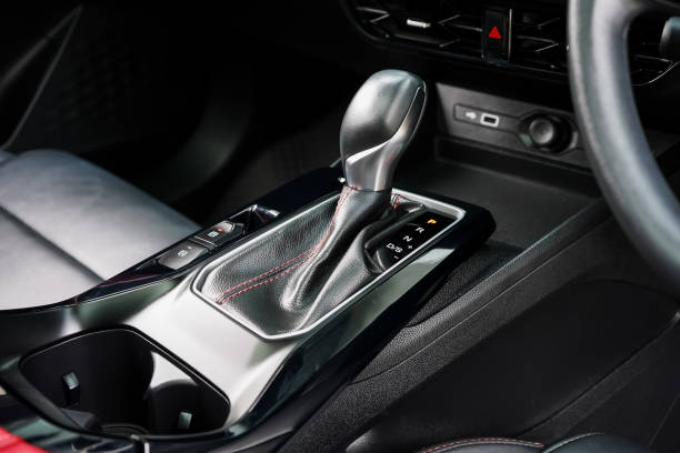 istock automatic transmission shift selector in the car interior. Closeup a manual shift of modern car gear shifter. 4x4 gear shift 1694984531
