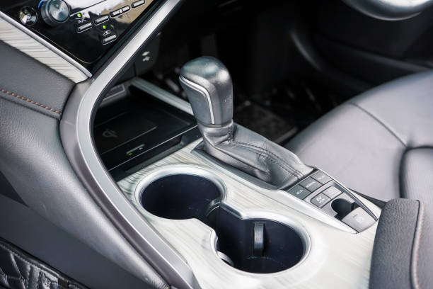 istock automatic transmission shift selector in the car interior. Closeup a manual shift of modern car gear shifter. 4x4 gear shift 1694985583