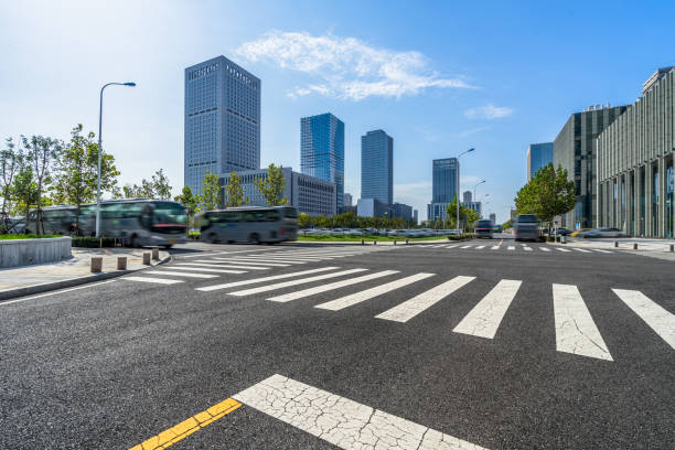 istock empty road with zebra crossing and skyscrapers in modern city 1694986155