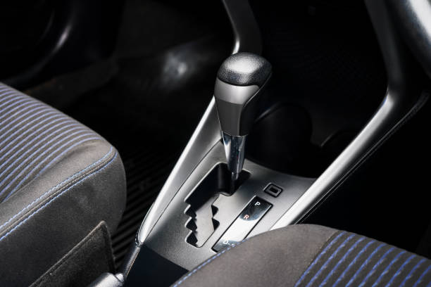 istock automatic transmission shift selector in the car interior. Closeup a manual shift of modern car gear shifter. 4x4 gear shift 1694986162