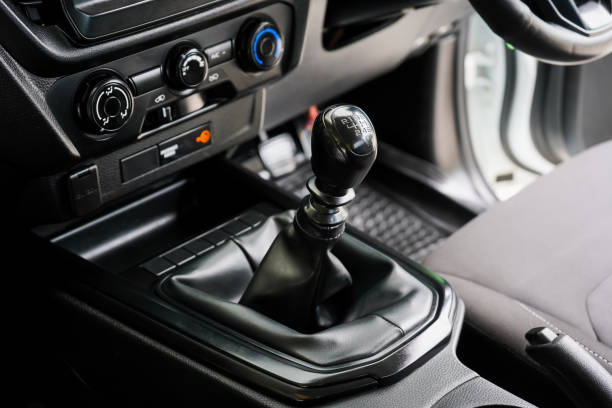 istock automatic transmission shift selector in the car interior. Closeup a manual shift of modern car gear shifter. 4x4 gear shift 1694986705