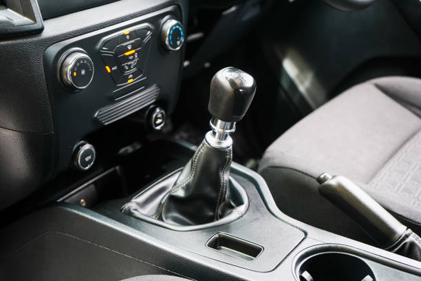 istock automatic transmission shift selector in the car interior. Closeup a manual shift of modern car gear shifter. 4x4 gear shift 1694986712