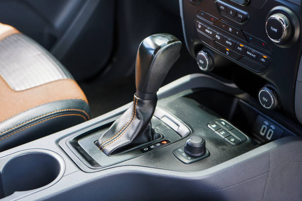istock automatic transmission shift selector in the car interior. Closeup a manual shift of modern car gear shifter. 4x4 gear shift 1694986746