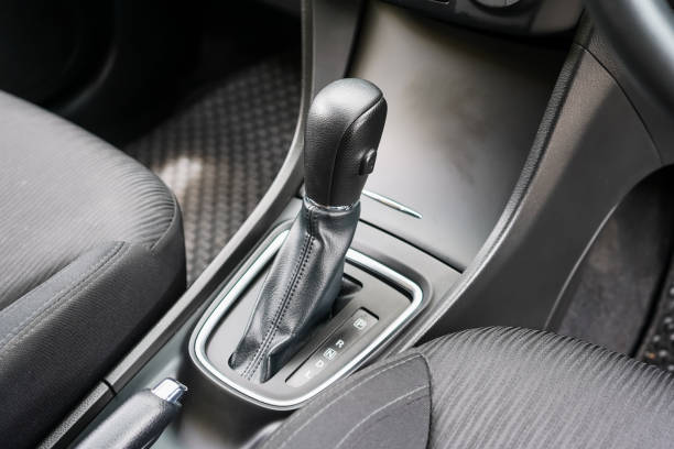 istock automatic transmission shift selector in the car interior. Closeup a manual shift of modern car gear shifter. 4x4 gear shift 1694987261