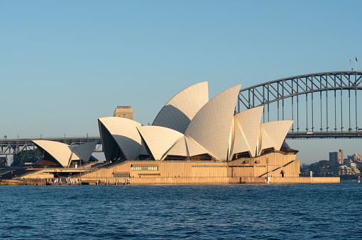 Sydney Australia - August 8, 2023: A clear morning in Sydney, New South Wales, and this is the view looking across Sydney Harbour towards the city's iconic Opera House and Harbour Bridge.