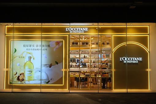 Shanghai,China-March 11th 2023: L'OCCITANE retail store exterior at night and advertisement