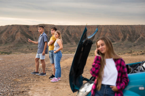 istock Group of friends asking for help after car breakdown 1695031203