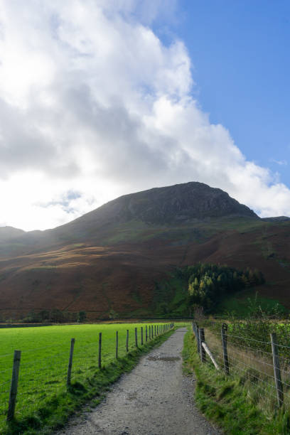 istock Footpath going to hill against sky in Lake District in autumn 1695056098