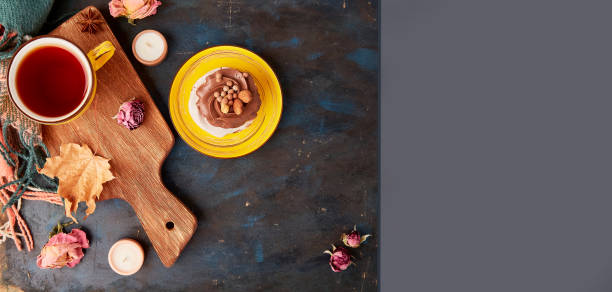 Aesthetic Pavlova cake, Tea Cup. Autumn aesthetics tea time vibes flat lay.Extra wide banner