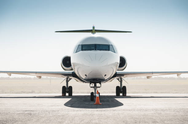 istock White passenger regional jet facing the camera. 1695077051