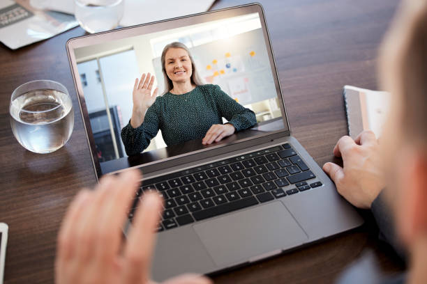 istock Video call, computer and greeting wave of a person on a computer conference digital chat. Laptop screen, technology and work web seminar of a woman waving in a online internet office meeting 1695081851