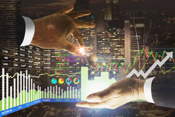 Stock financial index manipulated and control by businessman with graph, chart, candlesticks, number and arrow up symbol on metropolitan night scenic background. stock photo