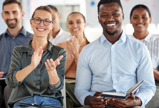 istock Business people, smile and applause for workshop training, conference or presentation at the office. Group of happy corporate employee workers clapping for meeting, convention or coaching at work 1695109842
