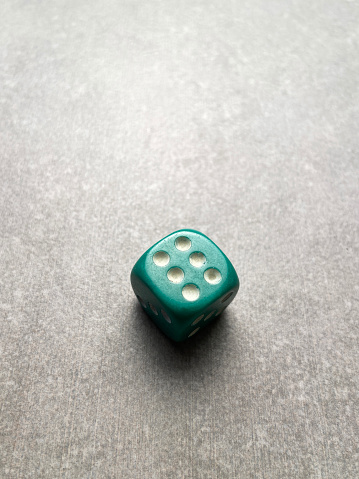 High angle view a dice on gray background with copy space