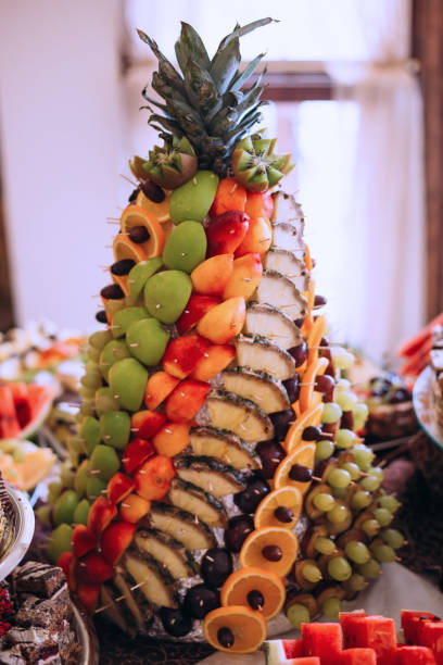 various fruits in the form of pineapple. beautiful and original decoration of the fruit table