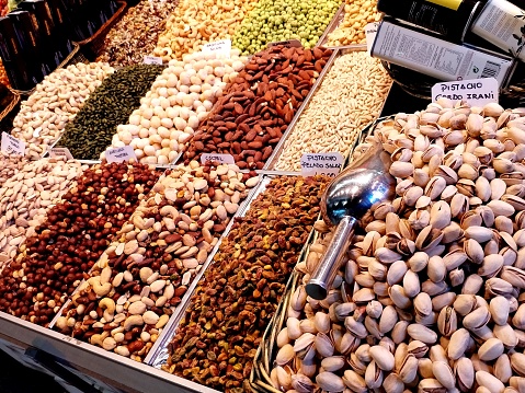A stall selling a variety of nuts and dried fruit at the Alicante fogueras festivities flea market.