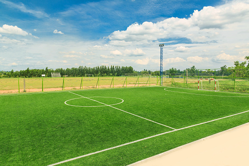 Artificial grass football field background Football field surface - midfield