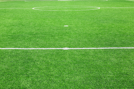 Artificial grass football field background. White lines. Grass football field. Football lines.