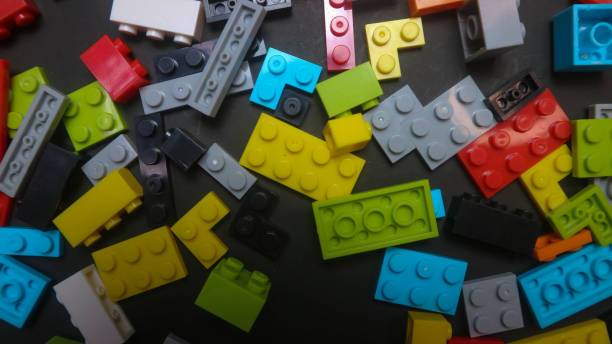 istock Plastic toy block on a black background 1695139933