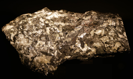 macro shooting of geological collection mineral - crystals of Vesuvianite (Idocrase, Vesuvian) on rock surface