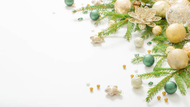 istock golden and green  christmas decorations  on white  background 1695149924