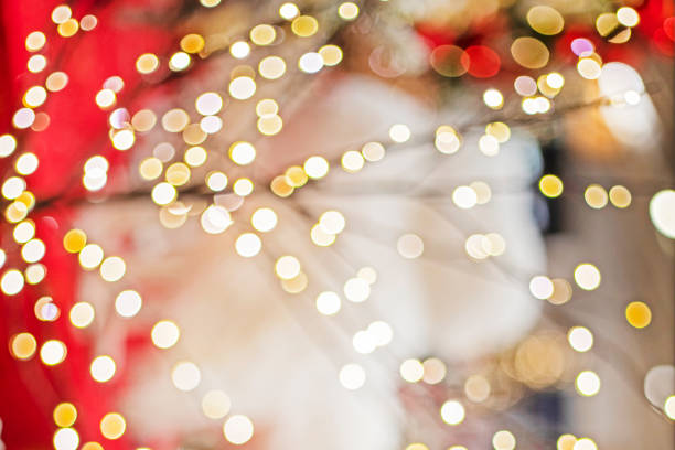 festive blurred background with glowing lights on red white background