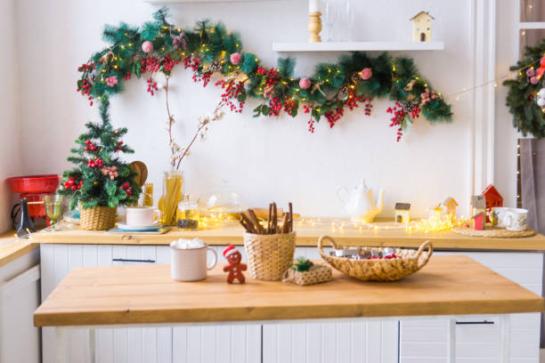 Kitchen interior decorated for Christmas and New Year. New Year's interior in red and white tones. stock photo