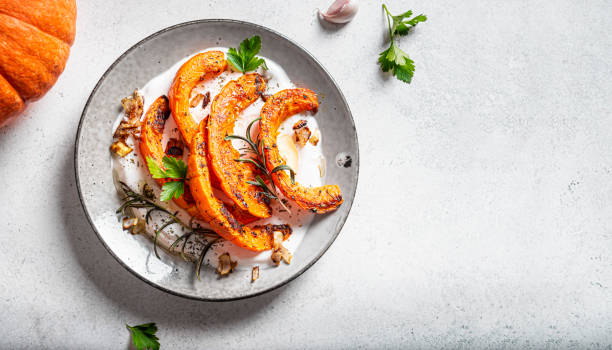 istock Grilled pumpkin with soft cheese and herbs 1695158983
