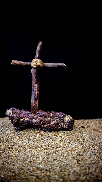 istock wooden cross on black background 1695163574