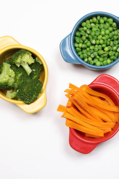 Mix of fresh vegetables in white beautiful bowl, top view