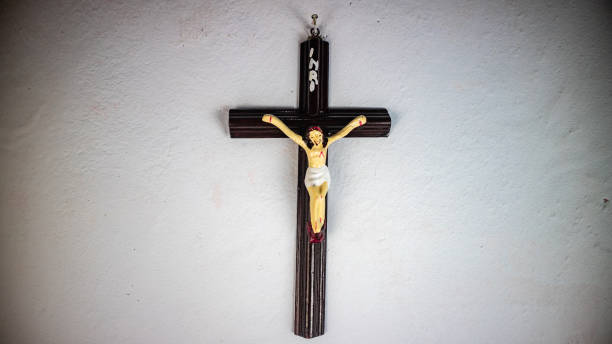 istock a cross hung on a white wall 1695174238