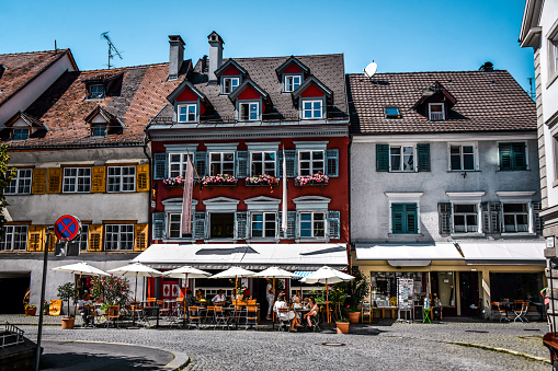 Many Coffee Bars And Apartment Buildings In Old Town Of Bregenz, Austria