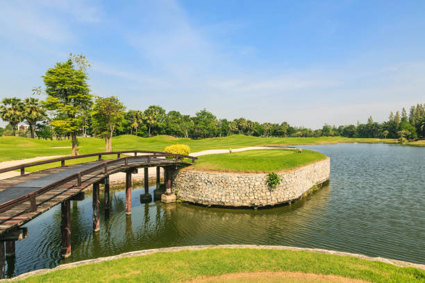 istock Beautiful green golf course and beautiful pond. 1695214219