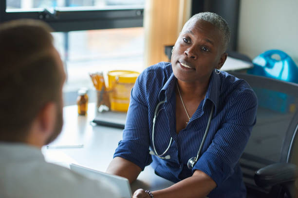 istock female gp listening to patient 1695262595