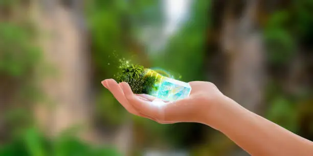Future technology concept design featuring a woman hand holding a miniature artificial plant