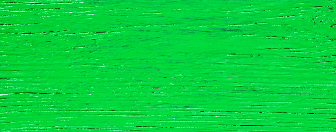 Green painted old wooden background texture for design.Selective focus.