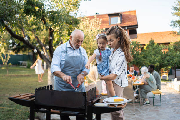 istock Multiracial family having fun during an barbecue party 1695328685
