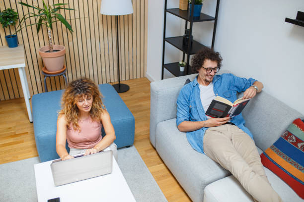istock Young couple in living room 1695333165