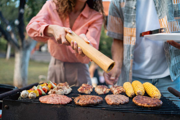 istock Unrecognizable young Caucasian couple making barbecue together 1695336117